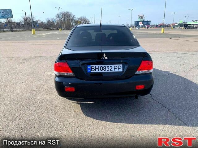 Черный Мицубиси Лансер, объемом двигателя 1.6 л и пробегом 200 тыс. км за 4500 $, фото 1 на Automoto.ua
