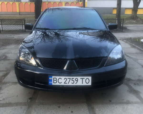 Черный Мицубиси Лансер, объемом двигателя 1.58 л и пробегом 230 тыс. км за 3600 $, фото 1 на Automoto.ua