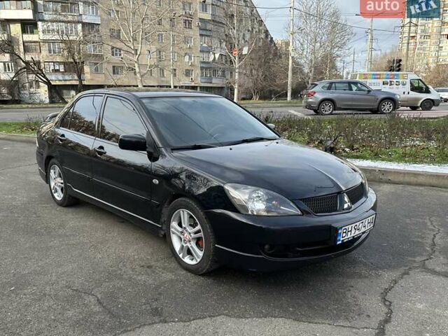 Черный Мицубиси Лансер, объемом двигателя 2 л и пробегом 271 тыс. км за 5300 $, фото 1 на Automoto.ua