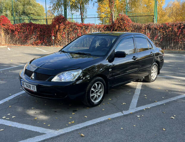 Чорний Міцубісі Lancer, об'ємом двигуна 1.58 л та пробігом 175 тис. км за 5200 $, фото 1 на Automoto.ua