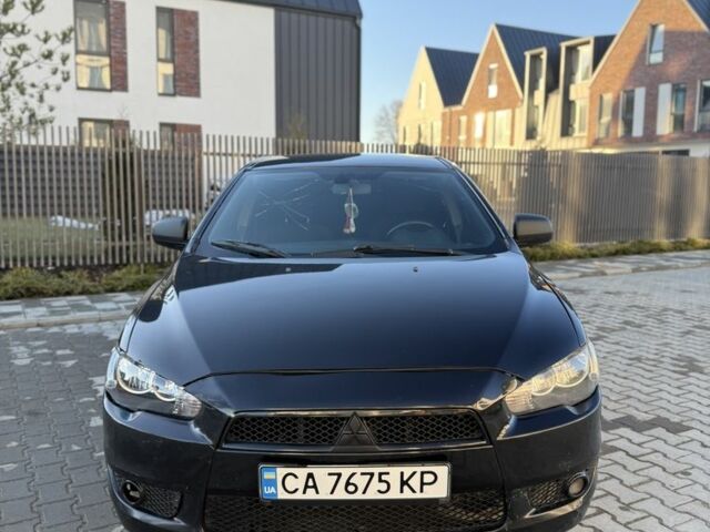 Черный Мицубиси Лансер, объемом двигателя 2 л и пробегом 285 тыс. км за 4800 $, фото 1 на Automoto.ua