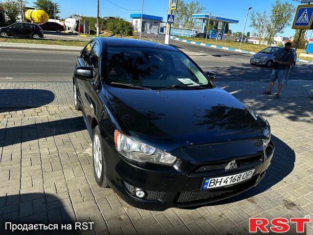 Черный Мицубиси Лансер, объемом двигателя 2 л и пробегом 250 тыс. км за 5900 $, фото 1 на Automoto.ua