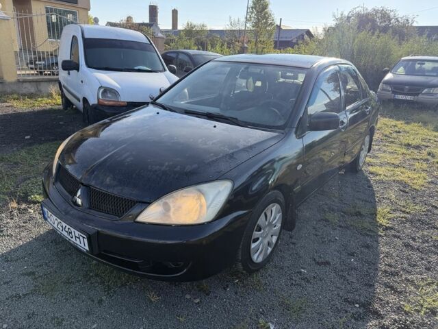 Чорний Міцубісі Lancer, об'ємом двигуна 1.6 л та пробігом 300 тис. км за 3011 $, фото 1 на Automoto.ua
