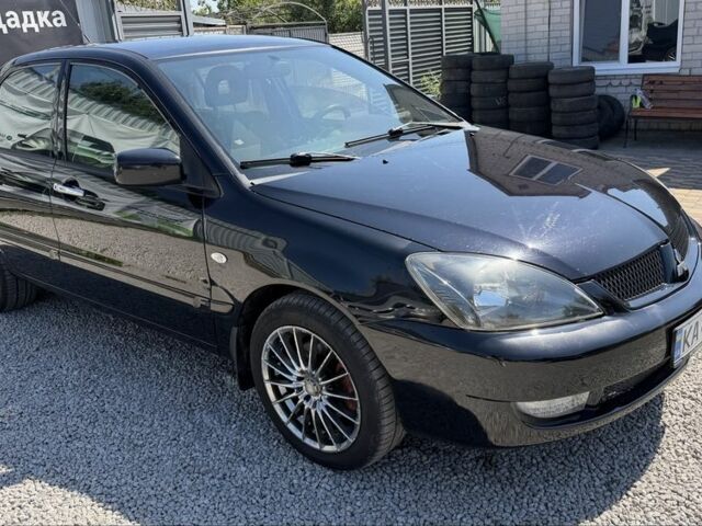 Чорний Міцубісі Lancer, об'ємом двигуна 1.6 л та пробігом 250 тис. км за 3494 $, фото 1 на Automoto.ua