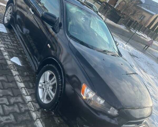 Черный Мицубиси Лансер, объемом двигателя 2 л и пробегом 380 тыс. км за 4300 $, фото 1 на Automoto.ua