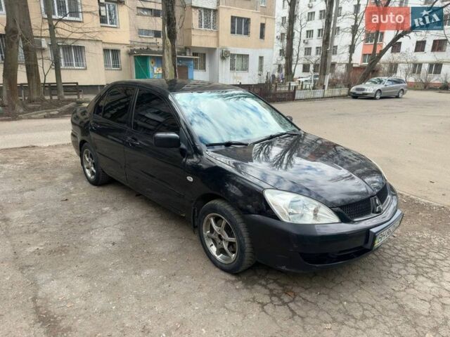 Чорний Міцубісі Lancer, об'ємом двигуна 1.58 л та пробігом 150 тис. км за 4500 $, фото 1 на Automoto.ua