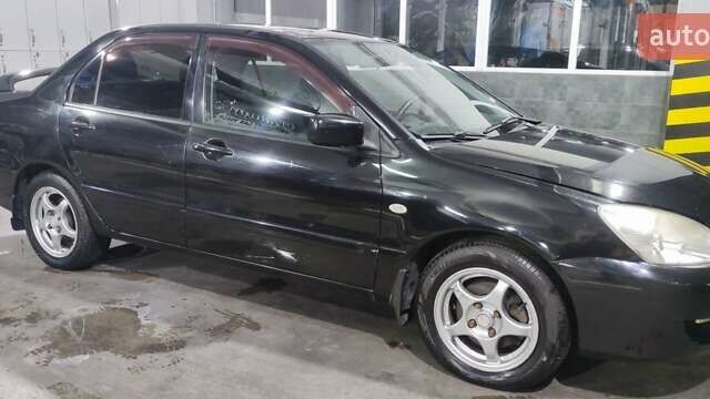 Чорний Міцубісі Lancer, об'ємом двигуна 1.6 л та пробігом 88 тис. км за 4650 $, фото 1 на Automoto.ua