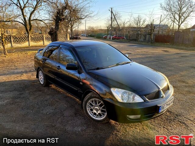 Черный Мицубиси Лансер, объемом двигателя 1.6 л и пробегом 352 тыс. км за 3600 $, фото 1 на Automoto.ua