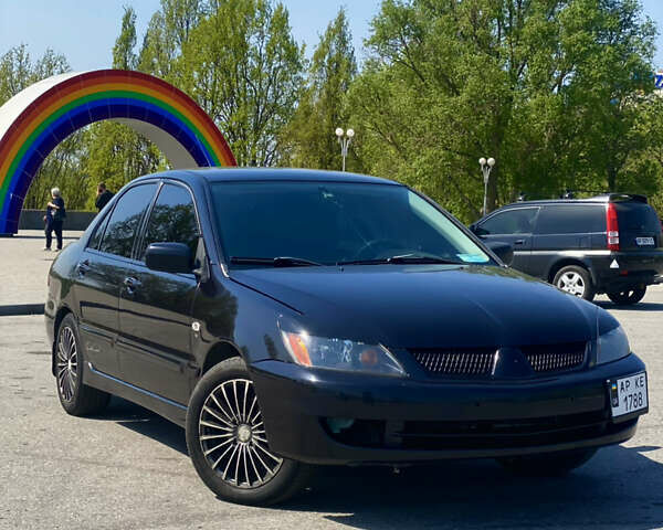 Чорний Міцубісі Lancer, об'ємом двигуна 1.58 л та пробігом 270 тис. км за 5390 $, фото 1 на Automoto.ua