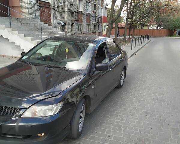 Чорний Міцубісі Lancer, об'ємом двигуна 1.6 л та пробігом 280 тис. км за 4550 $, фото 1 на Automoto.ua