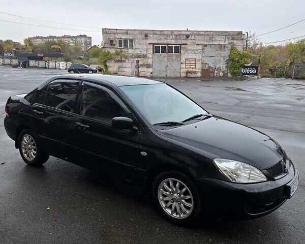 Мицубиси Лансер 2007 в Кривом Роге на Automoto.ua Черный Мицубиси Лансер, объемом двигателя 1.6 л и пробегом 200 тыс. км за 4900 $, фото 1 на Automoto.ua