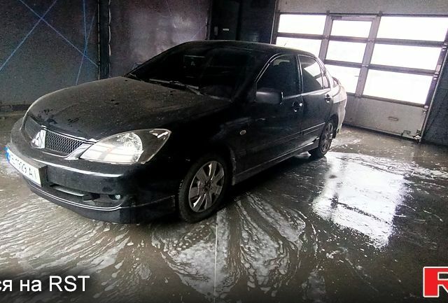 Чорний Міцубісі Lancer, об'ємом двигуна 2 л та пробігом 285 тис. км за 5700 $, фото 1 на Automoto.ua