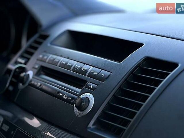 Черный Мицубиси Лансер, объемом двигателя 2 л и пробегом 205 тыс. км за 6500 $, фото 1 на Automoto.ua