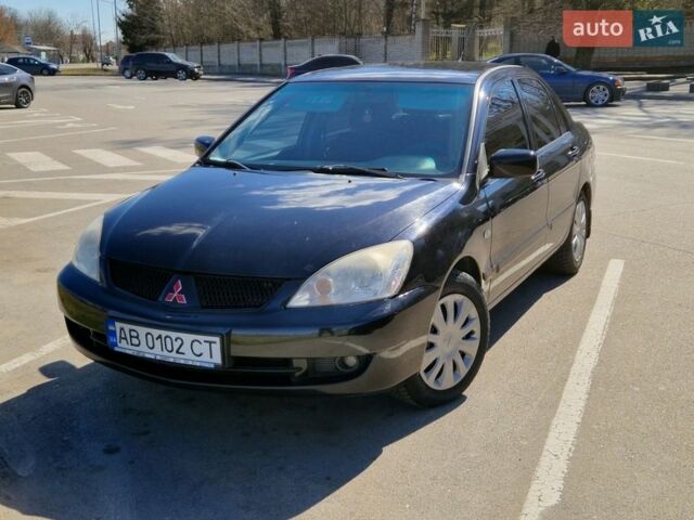Чорний Міцубісі Lancer, об'ємом двигуна 1.6 л та пробігом 181 тис. км за 4900 $, фото 1 на Automoto.ua