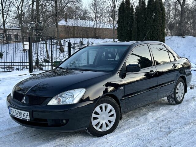 Черный Мицубиси Лансер, объемом двигателя 1.6 л и пробегом 192 тыс. км за 4950 $, фото 1 на Automoto.ua