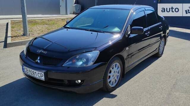 Чорний Міцубісі Lancer, об'ємом двигуна 2 л та пробігом 257 тис. км за 5100 $, фото 1 на Automoto.ua