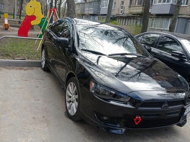 Черный Мицубиси Лансер, объемом двигателя 2 л и пробегом 245 тыс. км за 7500 $, фото 1 на Automoto.ua
