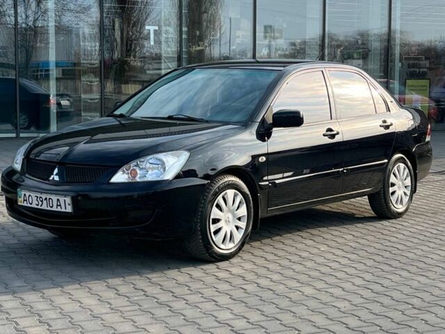 Черный Мицубиси Лансер, объемом двигателя 1.6 л и пробегом 186 тыс. км за 3900 $, фото 1 на Automoto.ua