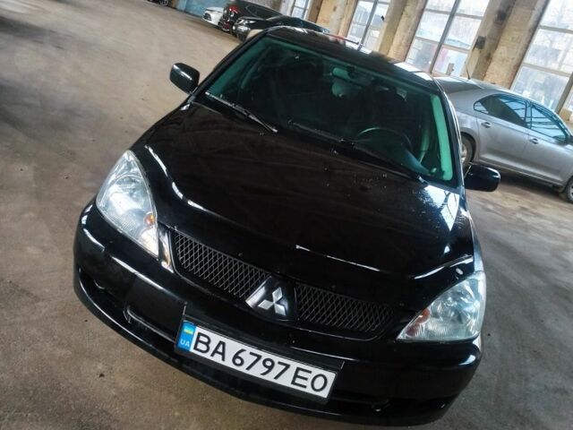 Чорний Міцубісі Lancer, об'ємом двигуна 1.6 л та пробігом 251 тис. км за 4500 $, фото 1 на Automoto.ua