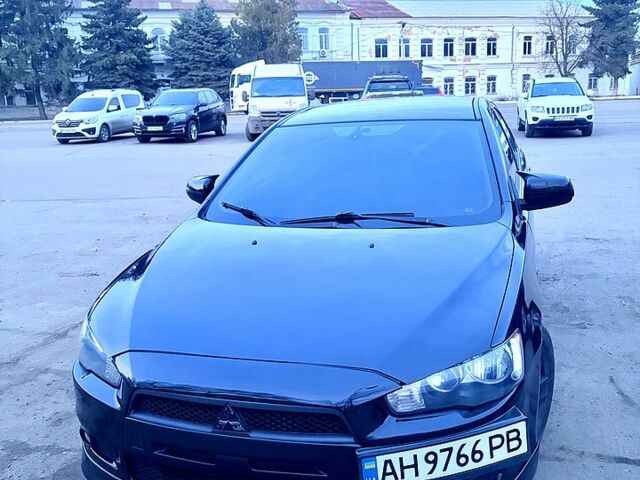 Черный Мицубиси Лансер, объемом двигателя 2 л и пробегом 250 тыс. км за 7500 $, фото 1 на Automoto.ua