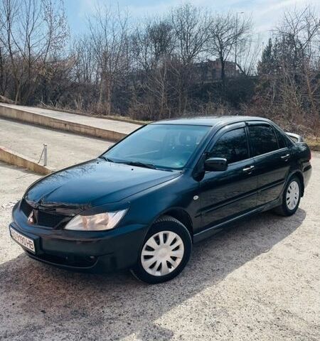 Черный Мицубиси Лансер, объемом двигателя 1.6 л и пробегом 280 тыс. км за 4500 $, фото 1 на Automoto.ua