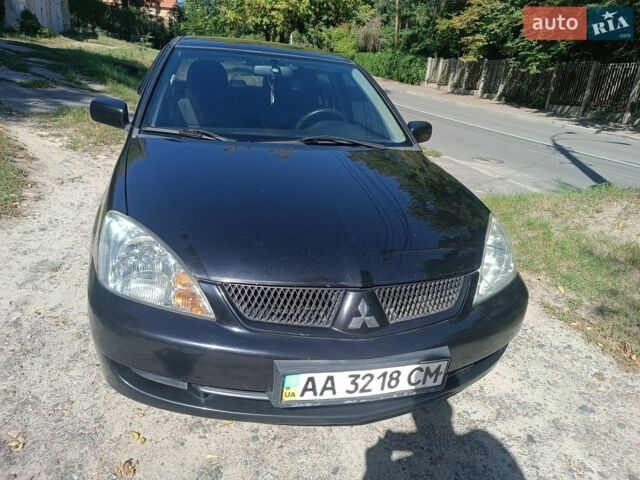 Чорний Міцубісі Lancer, об'ємом двигуна 1.58 л та пробігом 270 тис. км за 2700 $, фото 1 на Automoto.ua