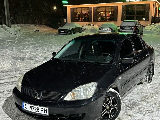 Черный Мицубиси Лансер, объемом двигателя 1.6 л и пробегом 260 тыс. км за 3950 $, фото 1 на Automoto.ua