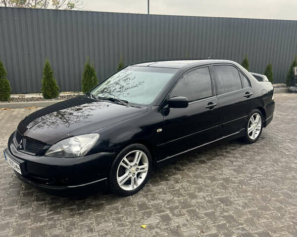 Чорний Міцубісі Lancer, об'ємом двигуна 2 л та пробігом 210 тис. км за 5500 $, фото 1 на Automoto.ua