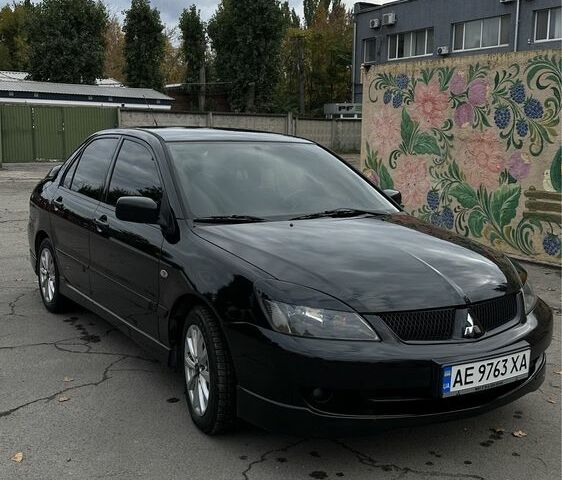Чорний Міцубісі Lancer, об'ємом двигуна 2 л та пробігом 143 тис. км за 5400 $, фото 1 на Automoto.ua