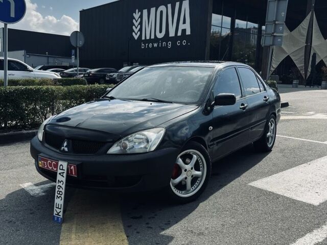 Чорний Міцубісі Lancer, об'ємом двигуна 1.6 л та пробігом 228 тис. км за 3600 $, фото 1 на Automoto.ua