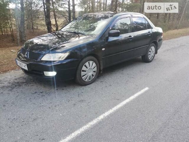 Чорний Міцубісі Lancer, об'ємом двигуна 1.58 л та пробігом 210 тис. км за 4200 $, фото 1 на Automoto.ua