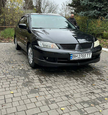 Чорний Міцубісі Lancer, об'ємом двигуна 1.59 л та пробігом 300 тис. км за 3400 $, фото 1 на Automoto.ua