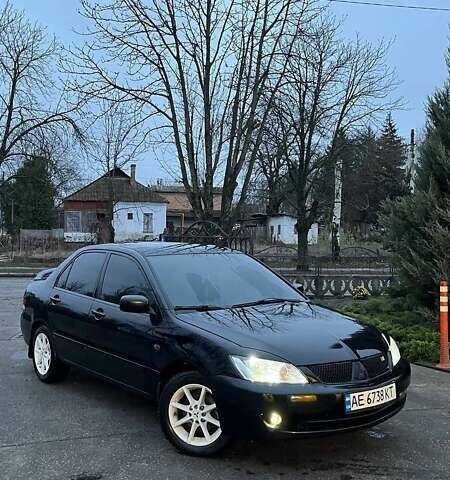 Черный Мицубиси Лансер, объемом двигателя 1.6 л и пробегом 249 тыс. км за 5000 $, фото 1 на Automoto.ua