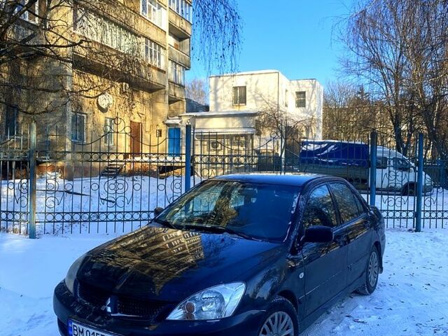 Черный Мицубиси Лансер, объемом двигателя 1.6 л и пробегом 29000 тыс. км за 3800 $, фото 1 на Automoto.ua