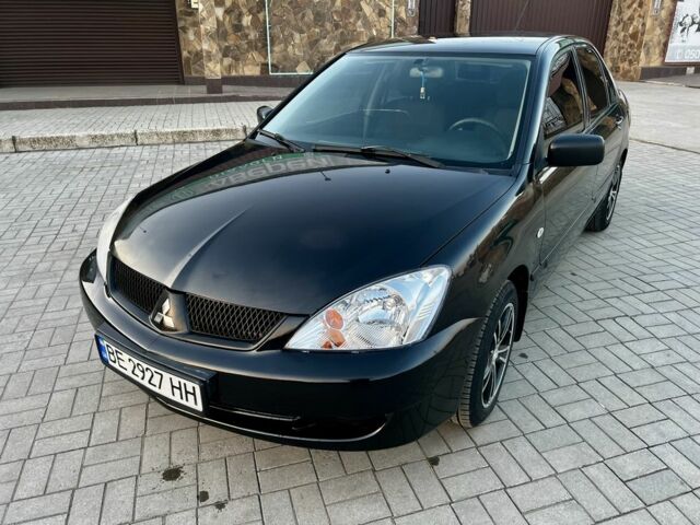 Черный Мицубиси Лансер, объемом двигателя 1.6 л и пробегом 291 тыс. км за 3399 $, фото 1 на Automoto.ua