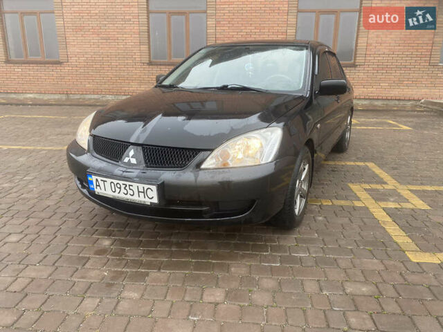 Черный Мицубиси Лансер, объемом двигателя 1.58 л и пробегом 211 тыс. км за 6333 $, фото 1 на Automoto.ua