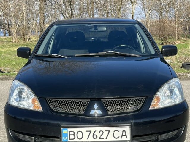 Черный Мицубиси Лансер, объемом двигателя 1.6 л и пробегом 230 тыс. км за 4600 $, фото 1 на Automoto.ua
