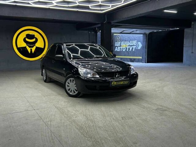 Черный Мицубиси Лансер, объемом двигателя 1.6 л и пробегом 286 тыс. км за 5900 $, фото 1 на Automoto.ua