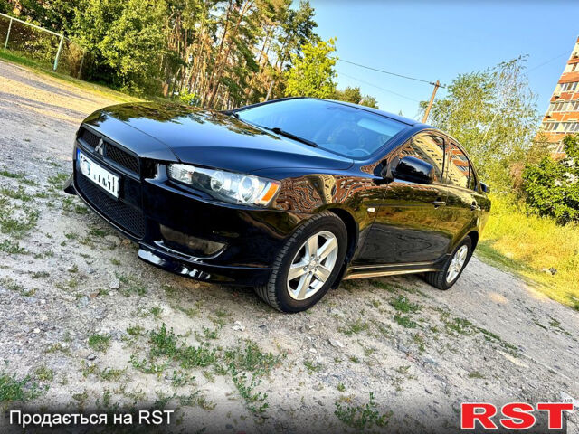 Черный Мицубиси Лансер, объемом двигателя 2 л и пробегом 157 тыс. км за 7690 $, фото 1 на Automoto.ua