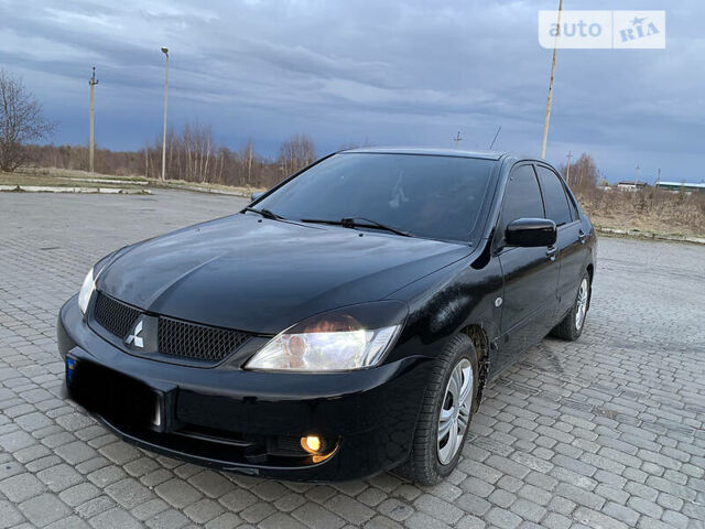 Чорний Міцубісі Lancer, об'ємом двигуна 1.6 л та пробігом 200 тис. км за 4650 $, фото 1 на Automoto.ua