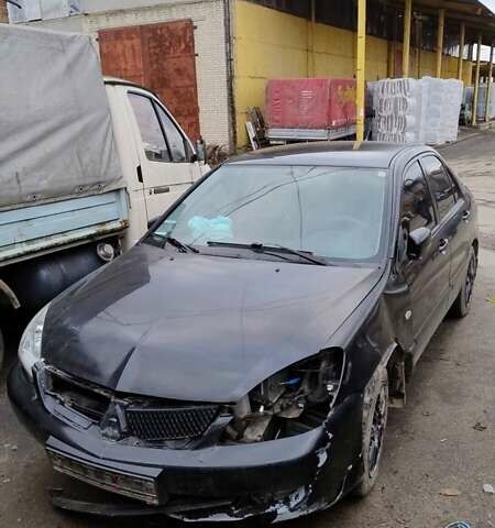 Черный Мицубиси Лансер, объемом двигателя 1.6 л и пробегом 200 тыс. км за 2000 $, фото 1 на Automoto.ua