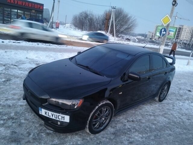 Черный Мицубиси Лансер, объемом двигателя 2 л и пробегом 243 тыс. км за 7000 $, фото 1 на Automoto.ua