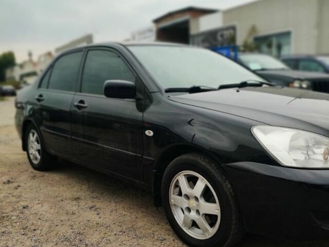 Чорний Міцубісі Lancer, об'ємом двигуна 1.6 л та пробігом 257 тис. км за 4200 $, фото 1 на Automoto.ua