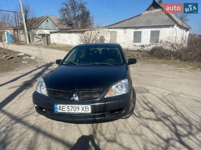 Черный Мицубиси Лансер, объемом двигателя 1.6 л и пробегом 311 тыс. км за 3150 $, фото 1 на Automoto.ua
