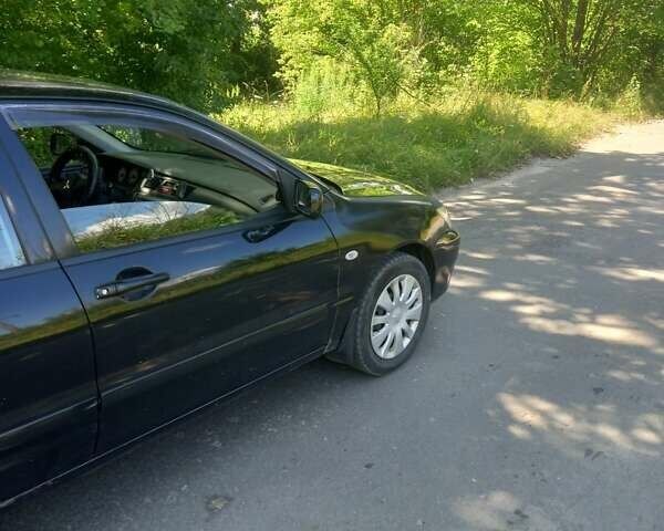 Черный Мицубиси Лансер, объемом двигателя 1.6 л и пробегом 320 тыс. км за 3800 $, фото 1 на Automoto.ua