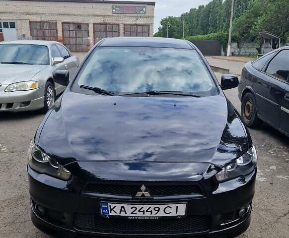 Черный Мицубиси Лансер, объемом двигателя 2 л и пробегом 178 тыс. км за 7000 $, фото 1 на Automoto.ua