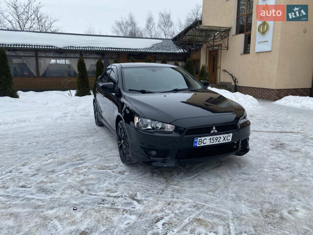 Черный Мицубиси Лансер, объемом двигателя 2 л и пробегом 257 тыс. км за 5200 $, фото 1 на Automoto.ua