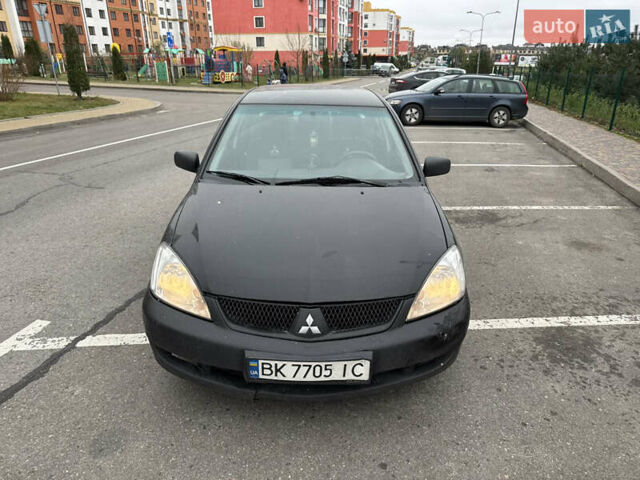 Чорний Міцубісі Lancer, об'ємом двигуна 1.58 л та пробігом 388 тис. км за 2300 $, фото 1 на Automoto.ua