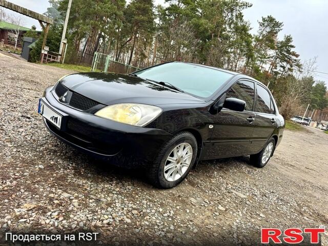Черный Мицубиси Лансер, объемом двигателя 1.6 л и пробегом 216 тыс. км за 5190 $, фото 1 на Automoto.ua