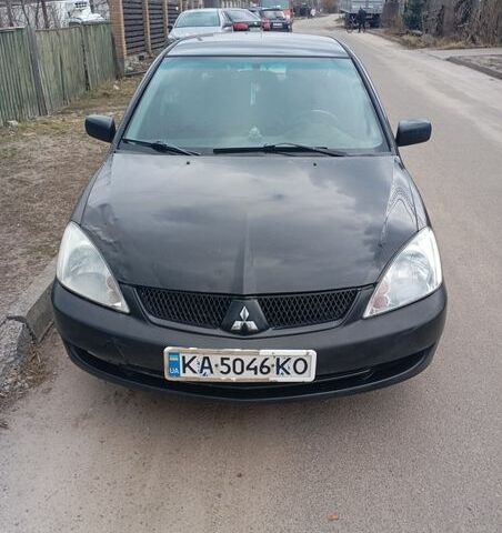 Черный Мицубиси Лансер, объемом двигателя 1.58 л и пробегом 281 тыс. км за 4200 $, фото 1 на Automoto.ua